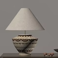 Ceramic Table Lamp With Beige Fabric Shade And Brown Geometric Patterns On Wooden Table