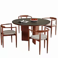Modern Round Wooden Dining Table and Four Upholstered Chairs with Fruit Bowl and Magazine