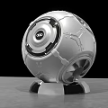 Modern Tech Inspired Spherical Silver White Sculpture With Black Circular Accents And Metallic Base
