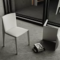 White Modern Dining Chairs With Sleek Design In Indoor Setting And Books