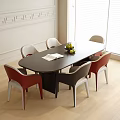 Oval Black Dining Table With Red White Black Chairs White Wall And Wooden Floor