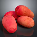 Four Fresh Red Potatoes With Small Spots On Black Smooth Surface Showing Reflections