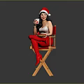 Woman In Santa Hat On Director's Chair With Red Stockings Holding Drink And Food Plate