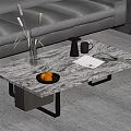 Modern Marble Coffee Table with Gray Sofa Vase Reeds Cup Oranges and Book