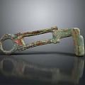 Ancient Bronze Key With Rusted Patina And Textured Surface On Dark