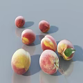 Fresh Pink And Yellow Peaches With Green Leaves On Smooth Gray Surface
