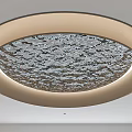 Elegant Circular Ceiling Design With Textured Wave Pattern And Light Frame