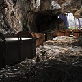 Cave With Treasure Chests Chains And Rocky Ground Illuminated By Light 3d model