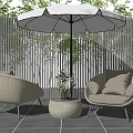 Outdoor Rattan Sofa Set With Beige Cushions White Umbrella Green Plants And Fence