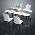 Modern Dining Table Set with Four White Chairs Black Legs Marble Top and Green Plant