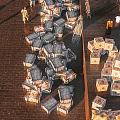 Open Outdoor Work Scene with Stacked Boxes Brick Paved Ground and People Organizing