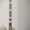 Modern Metallic Wall Lamp With Vertical LED Lights On Light Colored Wall And Gray Curtains