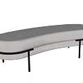 Modern Curved Ottoman With Beige Upholstered Surface And Black Metal Legs Design