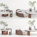 Modern Coffee Table Interior Design With Round Marble Top And Bronze Frame With Decorative Plants