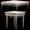 Elegant Ornate Silver Metal Coffee Table With Intricate Carved Patterns And Decorative Legs