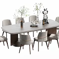 Modern Wooden Dining Table Set With Light Gray Upholstered Chairs And Green Plant Decor