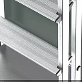 Silver Metal Folding Ladder With Four Steps And Black Handrails Near Light Green Cube
