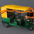Colorful Auto Rickshaw With Yellow Roof Green Body And Orange Garland Decorations