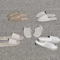 Cozy Beige And White Home Slippers On Light Carpet For Comfortable Wear