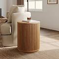 Wooden Side Table Next to Beige Armchair with Cup in Living Room Featuring Orange Sofa