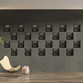 Modern Minimalist Gray Feature Wall With Black Square Frames Beige Chair And Green Plant