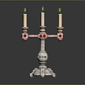 Decorative Candelabra With Three Lit Candles And Colorful Accents On Base
