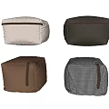 Various Colored Sofa Stools With Leather And Fabric Textures And Decorative Straps