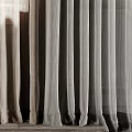 Sheer Lightweight Beige Curtains Filtering Soft Natural Light Through Window Panels