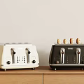 Modern Cream And Black Kitchen Toasters On Wooden Countertop With Toasted Bread Slices