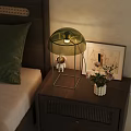 Bedside Table With Green Lamp Astronaut Figurine Flower Vase And Framed