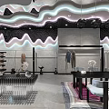 Elegant Modern Clothing Store Interior With Neon Lights Mirrors Display Racks Plants And Decorative Items