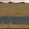 Desert Landscape With Railway Tracks Sparse Vegetation Under Sunset Sky And Distant Hills