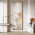 Abstract Painting On White Wall With Wooden Trim Green Plant And Small Figurine
