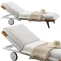 Stylish Sofa Bench Featuring White Cushion Wooden Armrest Wheels And Straw Hat Blanket