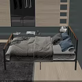 Double Bed with Wooden Metal Frame Gray Quilt Blue and Checkered Pillows Wooden Cabinet Mirror