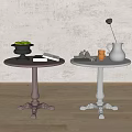 Dark and White Side Tables with Carved Bases and Decorative Green Bowl White Pitcher