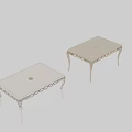 White Ornate Dining Table Featuring Intricate Carved Legs And Smooth Surface