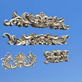 Decorative Metal Carvings With Intricate Scroll Patterns And Ornate Design Elements