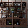Traditional Chinese Wooden Curio Cabinet With Decorative Vases Ornaments Plants And Books