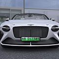 Luxury White Convertible Car With Sleek Body Front Grille And Alloy Wheels
