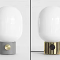 Table Lamps with White Oval Shades Gold Gray Bases on White Brick Wall White Tabletop