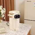 White Electric Water Dispenser With Digital Display On Kitchen Counter And Glass Cup
