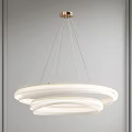 Modern White Chandelier With Circular Rings Hanging In Interior Space