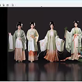 Women in green and white Hanfu with gradient skirts elaborate hairpieces holding fans and flowers