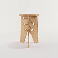 Handmade Wooden Stool With Natural Wood Grain And Rope Accents On Carved Legs