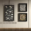 Three Abstract Paintings Black Framed Hanging On Light Wall With Floral Patterns And Striped Accent