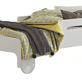 Wooden and White Kids Bed with Geometric Pattern Bedding and Wheel Design