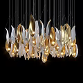 Modern Leaf Shaped Gold And White Chandelier With Illuminated Design Against Black Background