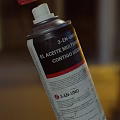 Industrial Equipment Two Lubricant Spray Cans with Red Caps for Machinery Maintenance