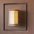 Modern Metal Frame Wall Sconce With Louvered Design And Soft Glow On Wooden Wall